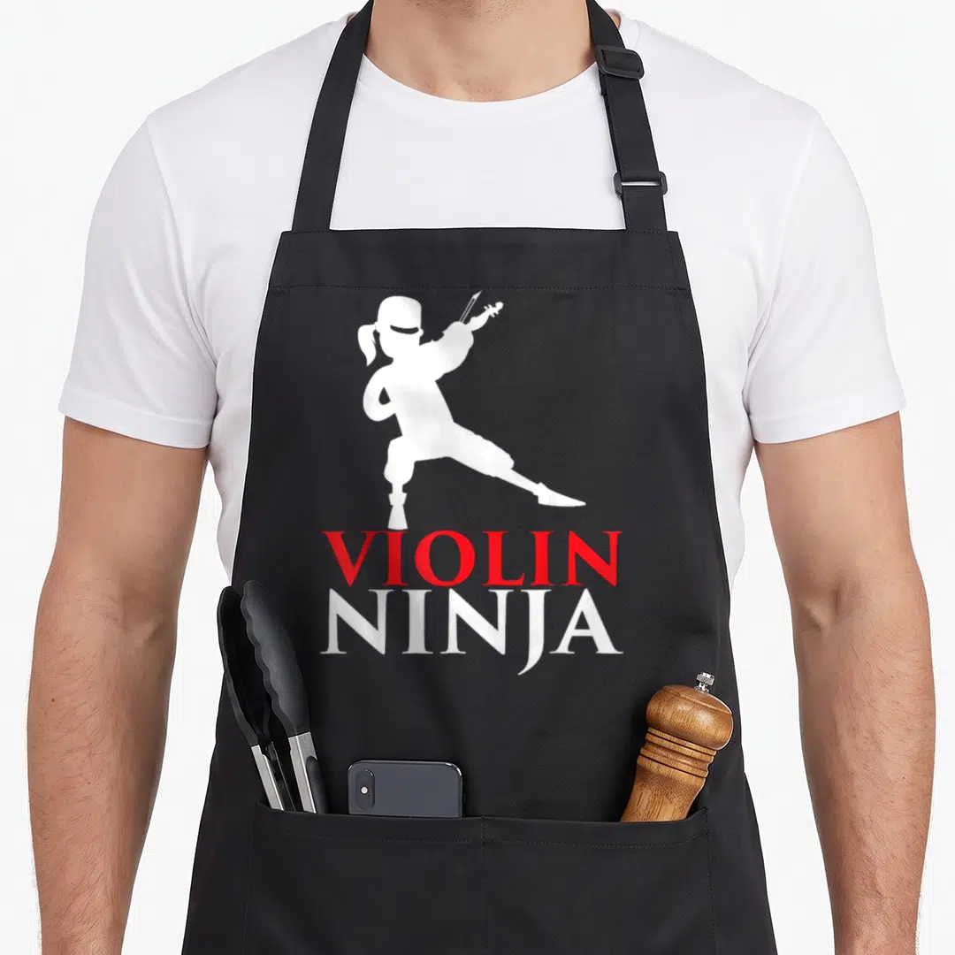 Ninja violinist violin themed accessories stuff apron - White ninja silhouette playing violin above red VIOLIN — shown on a black cotton canvas apron against a white background