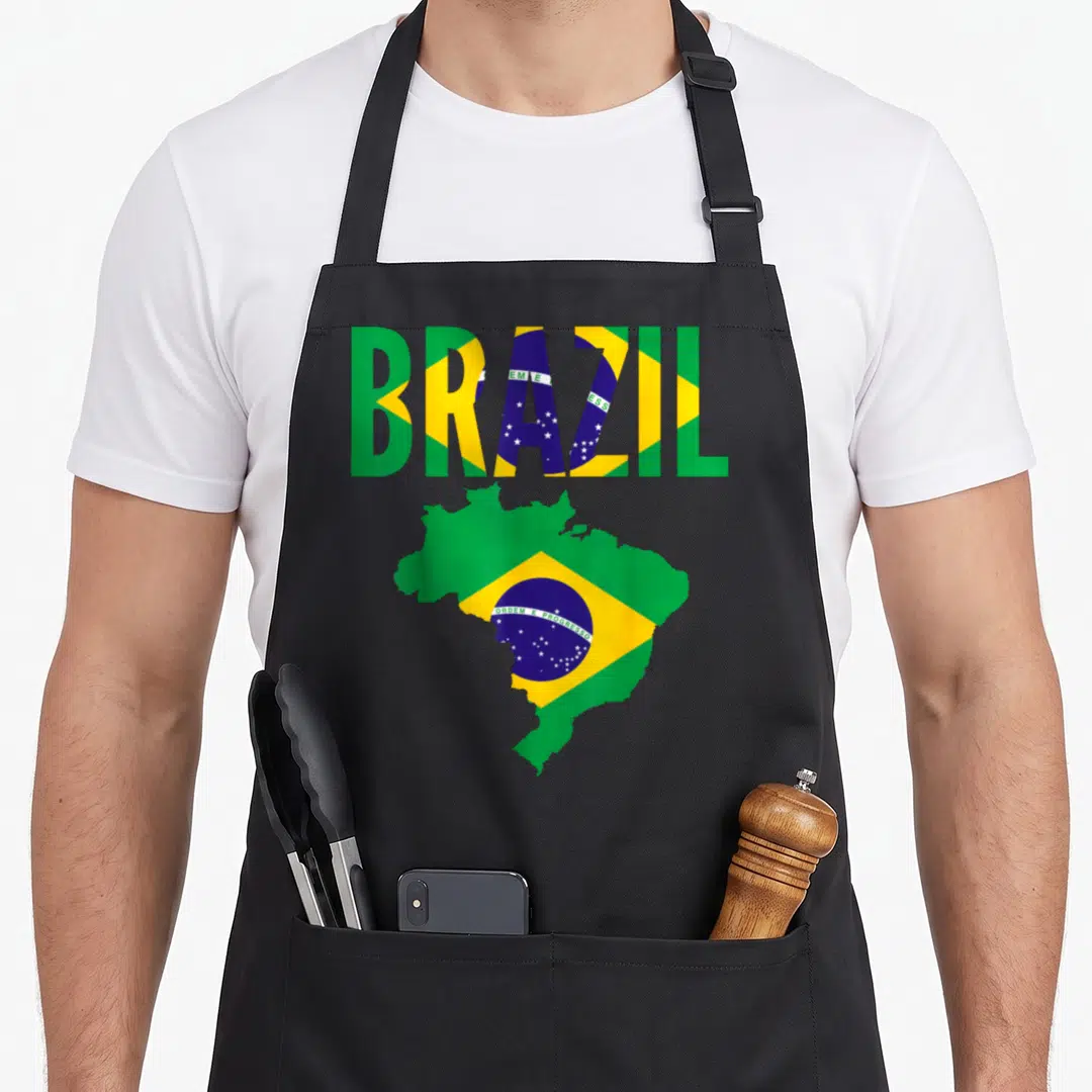 Brazilian country apron - BRAZIL text and Brazil map shape filled with green yellow blue and white flag pattern — shown on a black cotton canvas apron against a white background