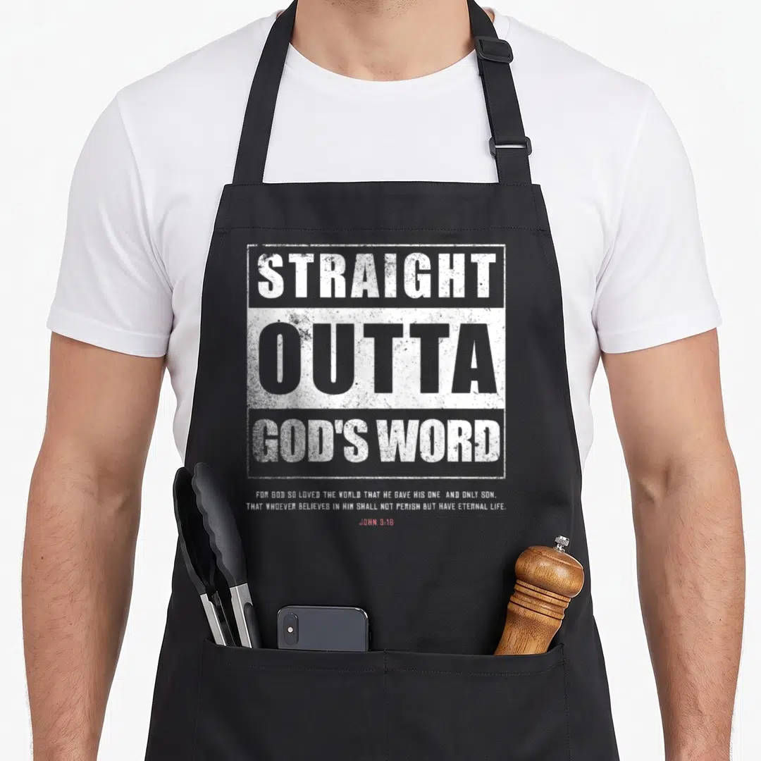 Straight christian apron - White stacked typography reading Straight Outta Gods Word and John 3:16 verse on black fabric — shown on a black cotton canvas apron against a white background