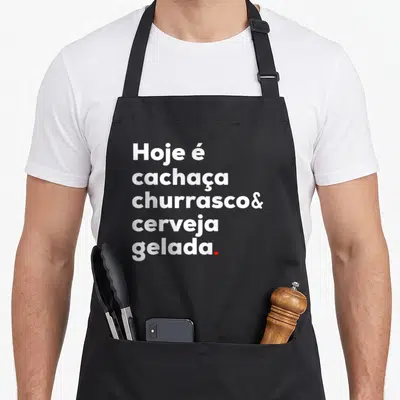 Churrasco cachaca apron - Stacked white text reading Hoje é cachaça churrasco cerveja gelada with red period — shown on a black cotton canvas apron against a white background
