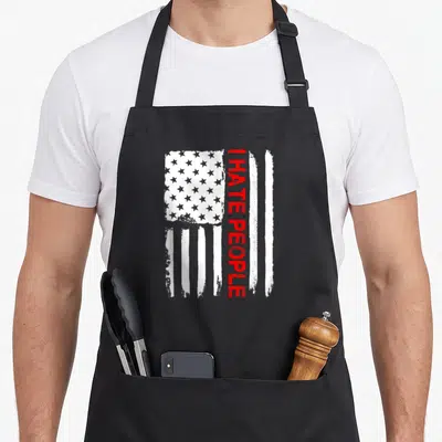 Hate flag apron - Vertical red I HATE PEOPLE text over distressed white and red USA flag stripes — shown on a black cotton canvas apron against a white background