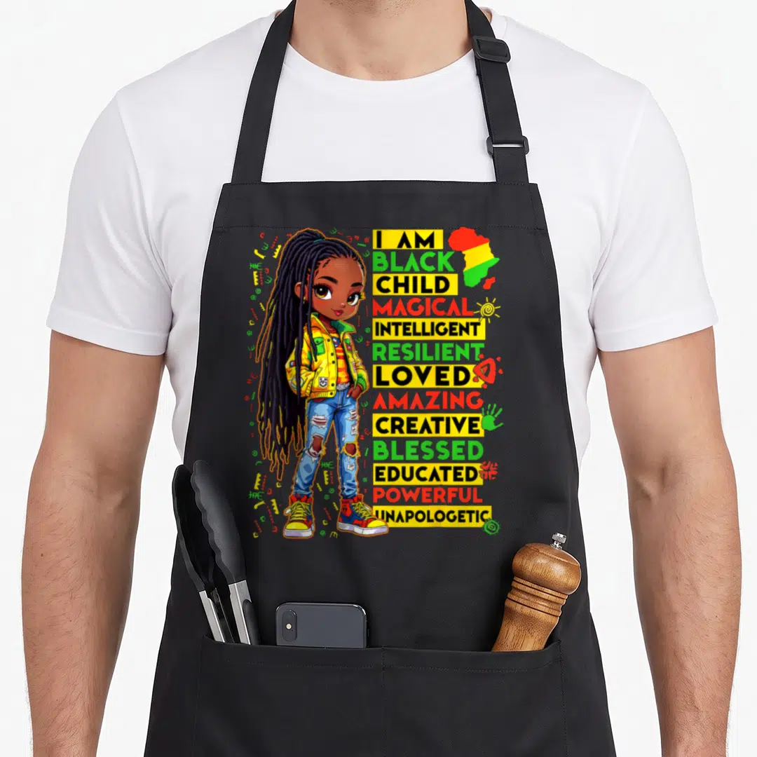 History month african american aprons - Cartoon girl with long dreadlocks standing next to stacked words like magical — shown on a black cotton canvas apron against a white background