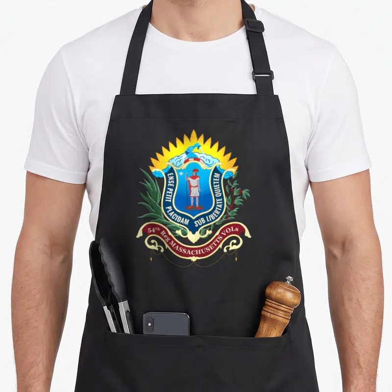 54th american flag apron - Coat of arms with soldier, sunburst, clouds, foliage, ribbon, blue gold red green colors — shown on a black cotton canvas apron against a white background