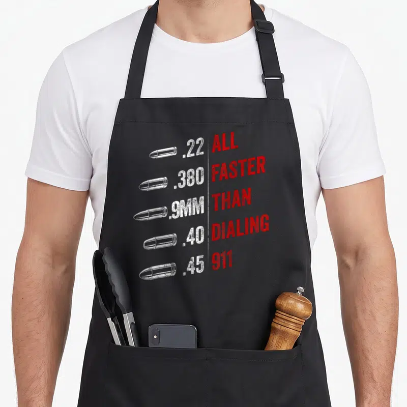 Faster american flag apron - Five white bullets next to red text reading ALL FASTER THAN DIALING 911 — shown on a black cotton canvas apron against a white background