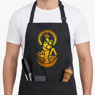 Maracaibo venezuela apron - Gold abstract crowned figure with radiating sun above curved bowl shape — shown on a black cotton canvas apron against a white background