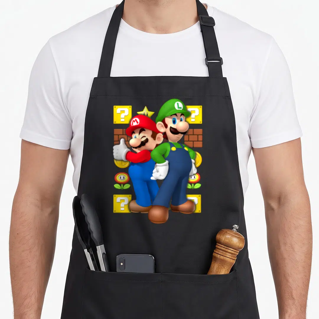 Funny thumb apron - Mario thumbs up back-to-back with Luigi surrounded by question blocks bricks coins flowers — shown on a black cotton canvas apron against a white background