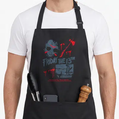Jason bloody apron - Grey and red distressed hockey mask axe and boat scene with tagline text — shown on a black cotton canvas apron against a white background