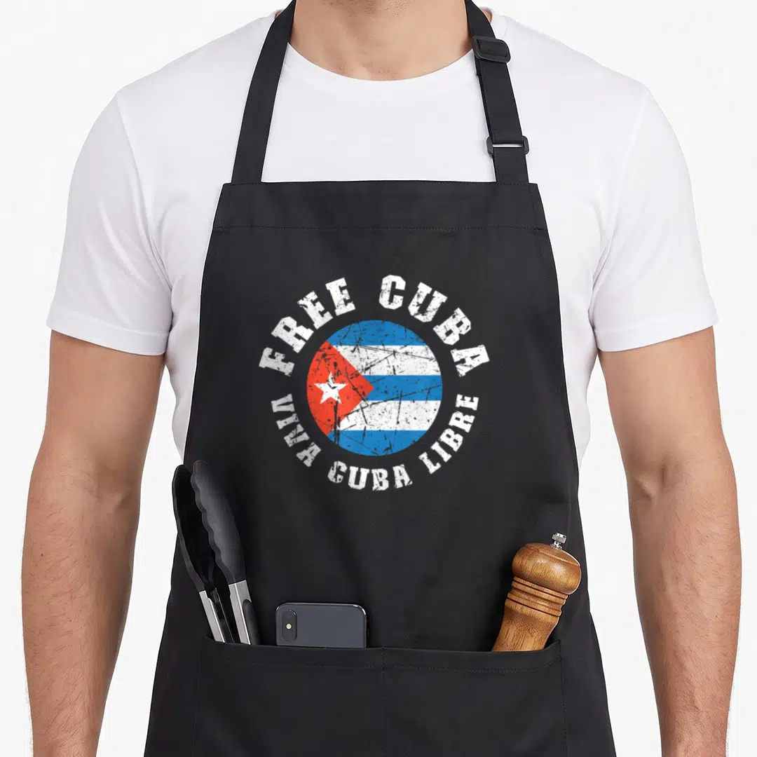 Free freedom of movement apron - Distressed circular Cuban flag with arching FREE CUBA and VIVA CUBA LIBRE text — shown on a black cotton canvas apron against a white background