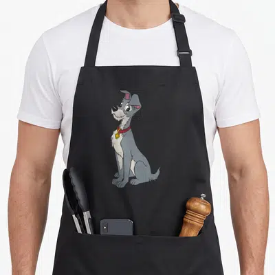 Simple portrait lady and the tramp apron - Grey cartoon dog sitting with red collar and yellow tag — shown on a black cotton canvas apron against a white background