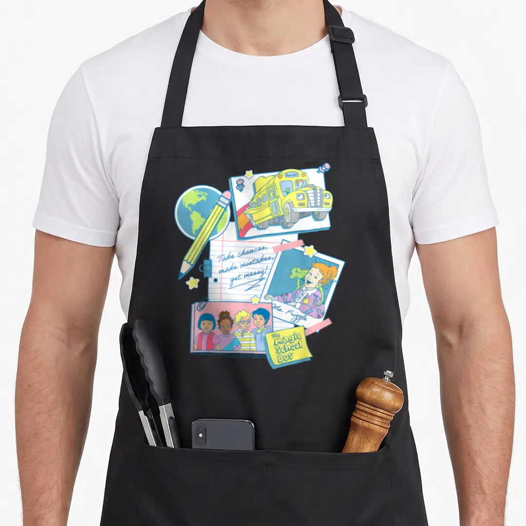 Magic classroom aprons - Retro Magic School Bus collage with globe, pencil, and Take chances make mistakes get messy — shown on a black cotton canvas apron against a white background