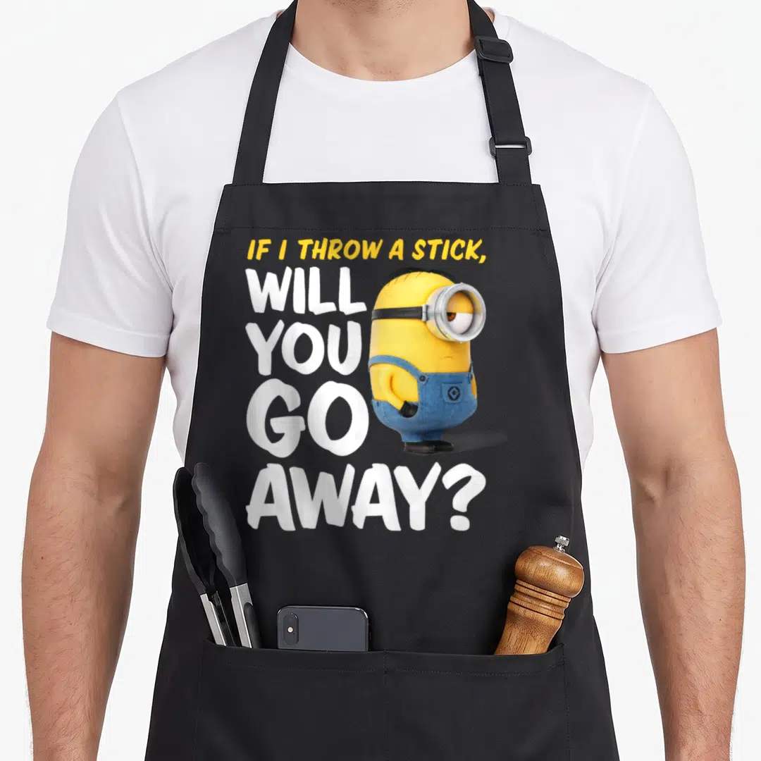 Away novelty apron - Stacked text reading IF I THROW A STICK WILL YOU GO AWAY next to a standing yellow minion in blue — shown on a black cotton canvas apron against a white background