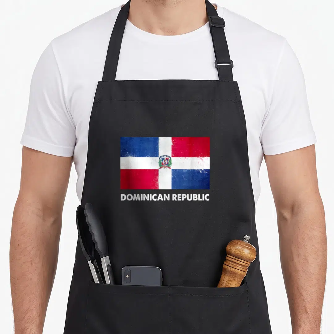 Republic dominica apron - Distressed Dominican Republic flag in red blue white above white text — shown on a black cotton canvas apron against a white background