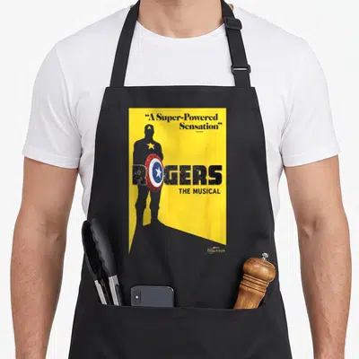 Roger love hawk apron - Grey Captain America silhouette with Rogers The Musical text and shield on yellow background — shown on a black cotton canvas apron against a white background