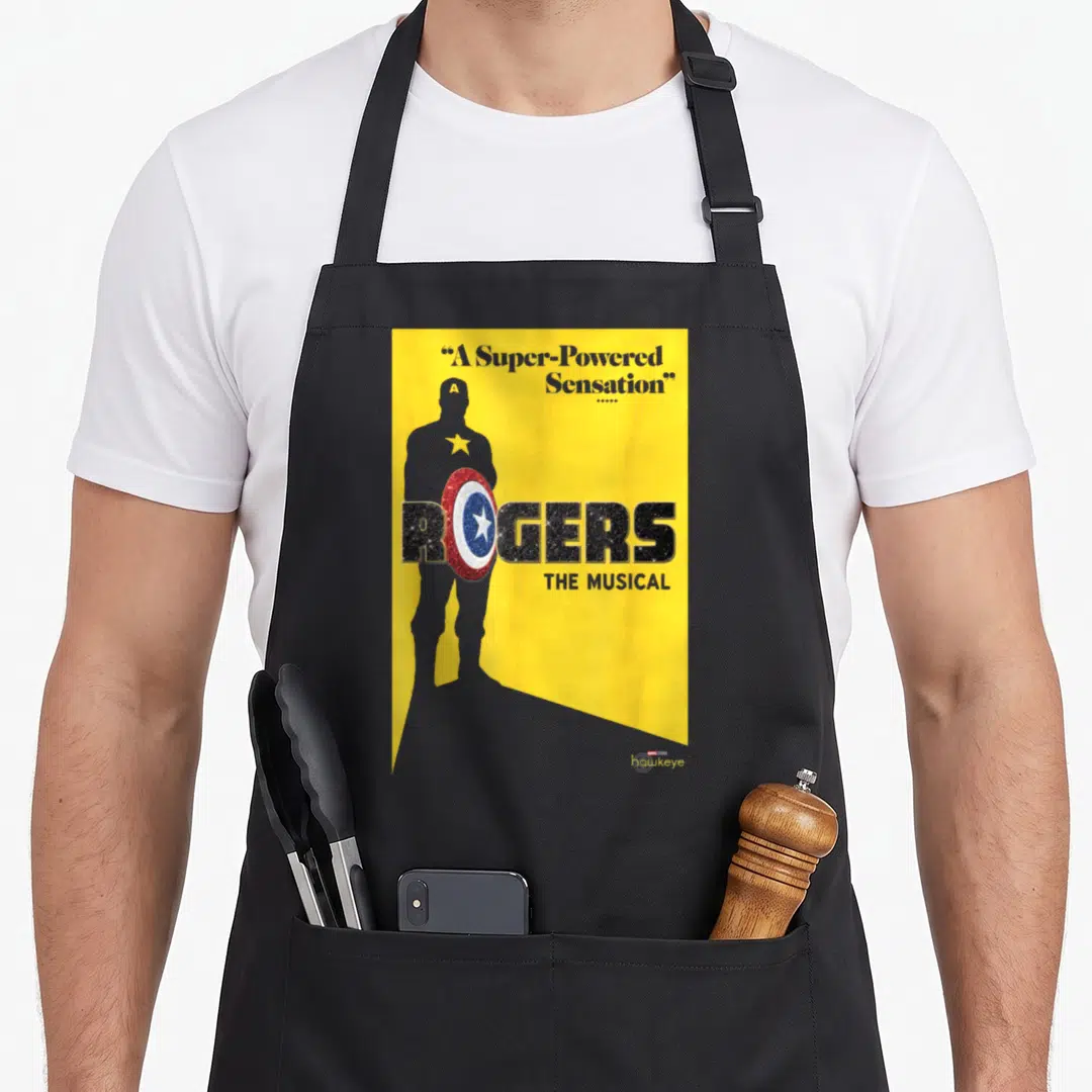 Roger love hawk apron - Grey Captain America silhouette with Rogers The Musical text and shield on yellow background — shown on a black cotton canvas apron against a white background