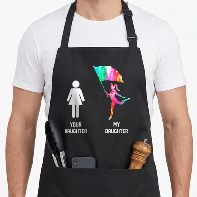 Funny guard mom daughter apron - YOUR DAUGHTER and MY DAUGHTER text below white female symbol and watercolor flag holder — shown on a black cotton canvas apron against a white background
