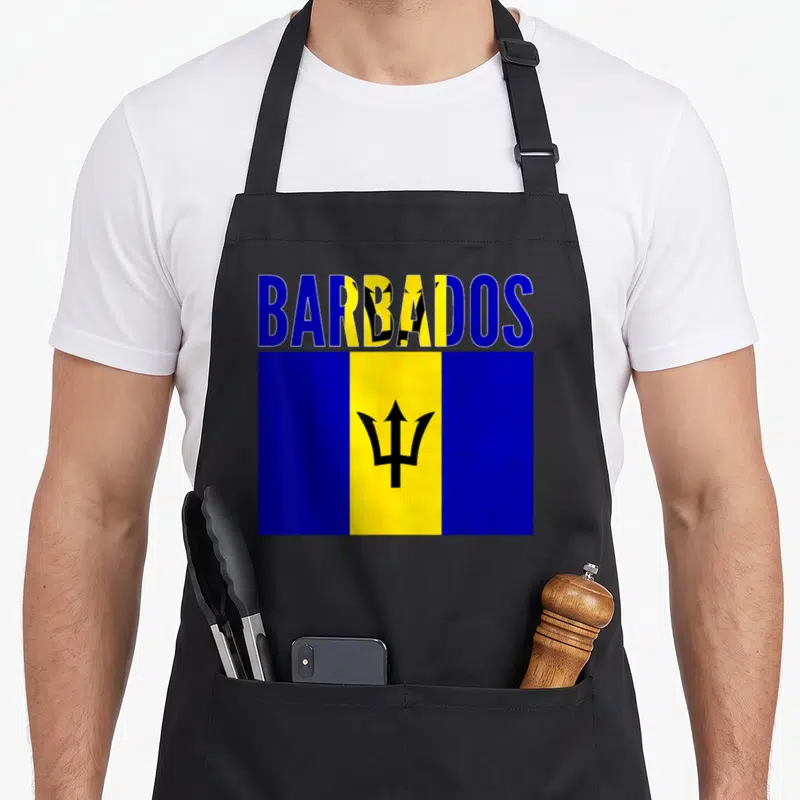 Barbadian country apron - BARBADOS text above blue yellow black flag with trident symbol — shown on a black cotton canvas apron against a white background