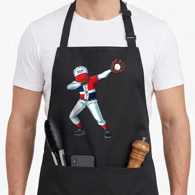 Dabbing baseball apron - Cartoon baseball player dabbing in red white blue uniform with DOM cap — shown on a black cotton canvas apron against a white background