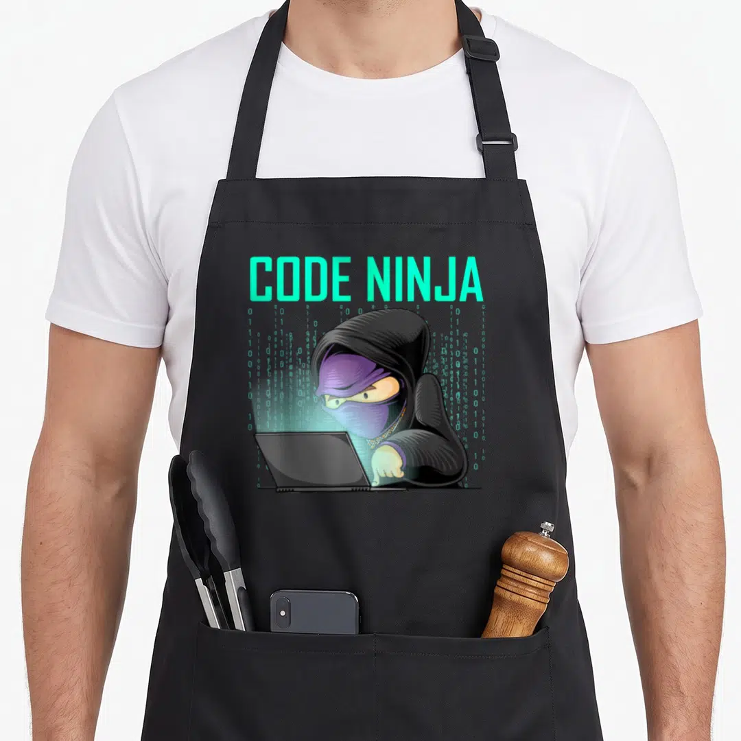 Web geek apron - CODE NINJA text above ninja in purple mask using laptop with cyan binary code — shown on a black cotton canvas apron against a white background