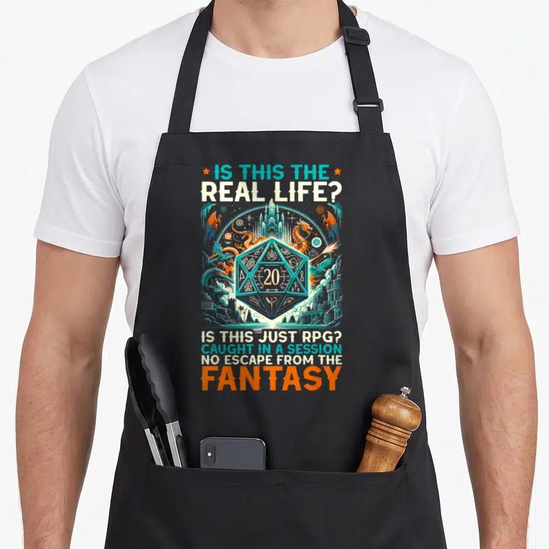 Role master apron - Teal D20 die surrounded by orange dragons and castle with fantasy RPG text — shown on a black cotton canvas apron against a white background