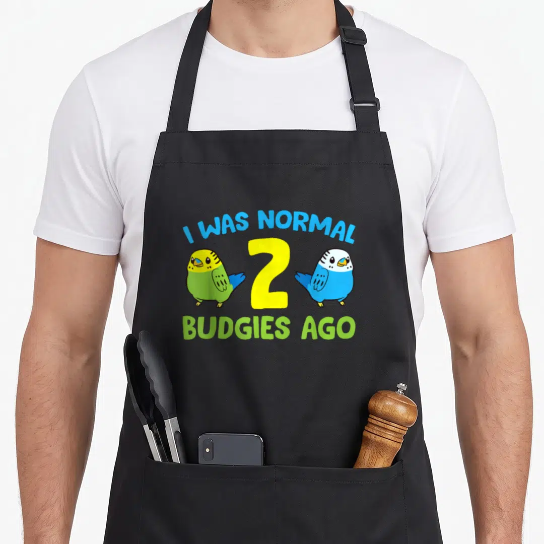 Normal parakeet lover apron - Cartoon budgies in blue and yellow green flanking the number 2 under arched text — shown on a black cotton canvas apron against a white background