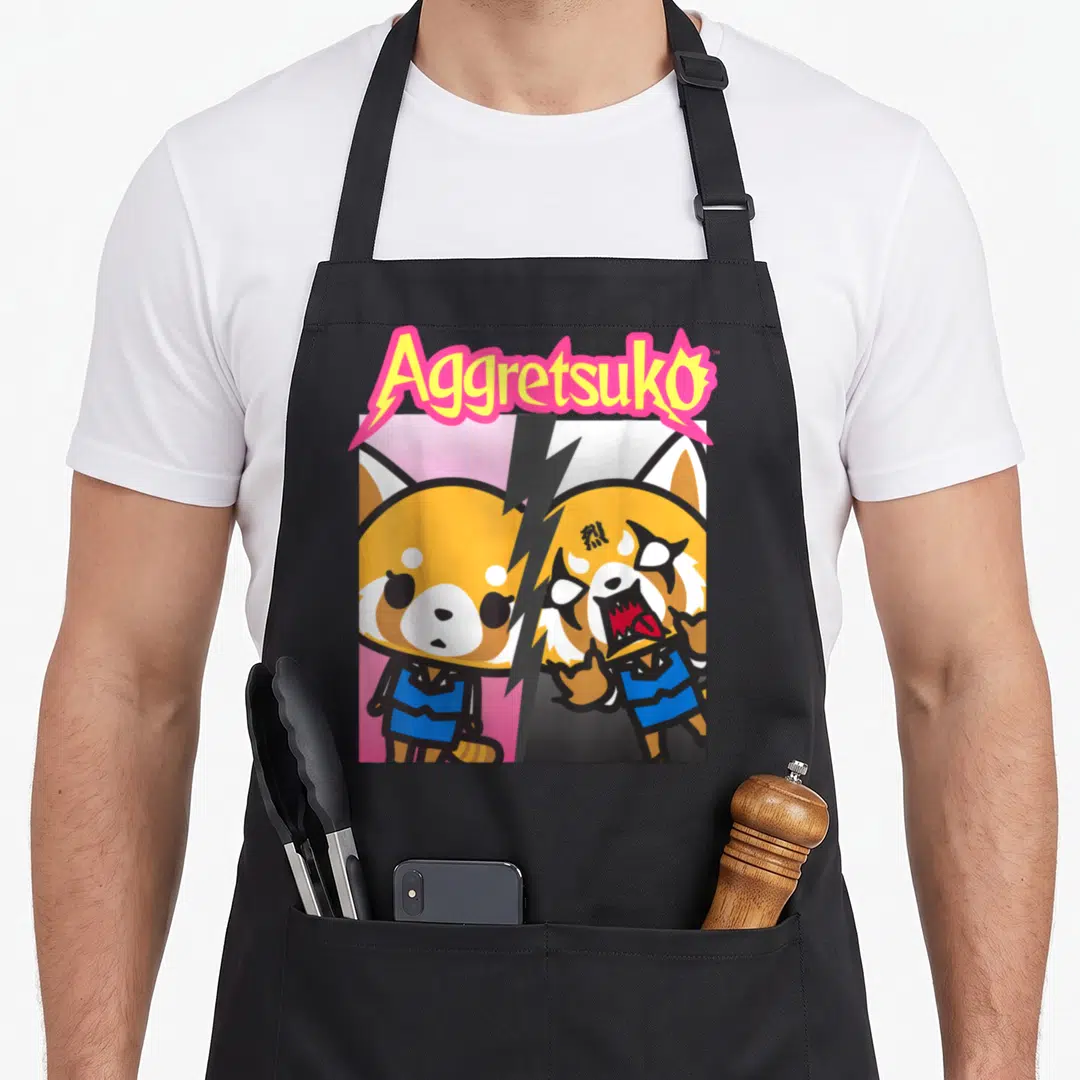 Personality split apron - Arched Aggretsuko text over split calm and angry red panda in cartoon style with lightning — shown on a black cotton canvas apron against a white background