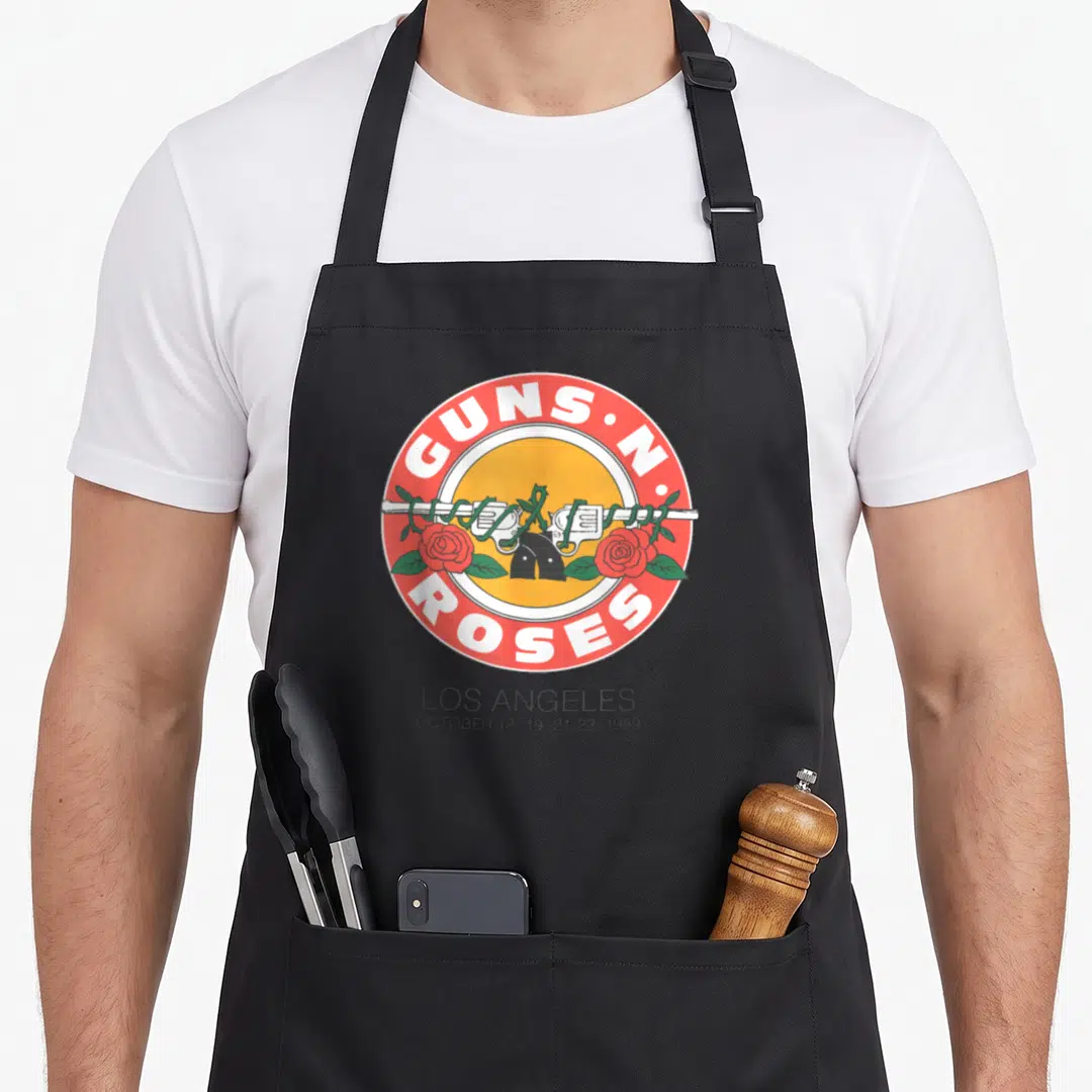 Seal rose apron - Guns N Roses 1989 LA concert logo with crossed guns and roses — shown on a black cotton canvas apron against a white background