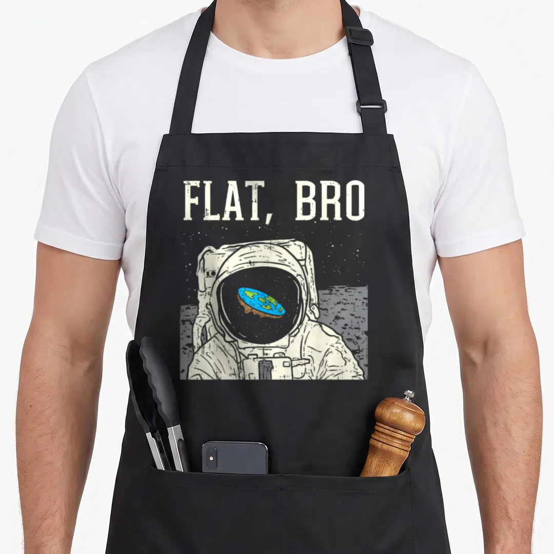 Bro flat apron - Distressed astronaut with flat earth reflection in visor and text FLAT BRO — shown on a black cotton canvas apron against a white background