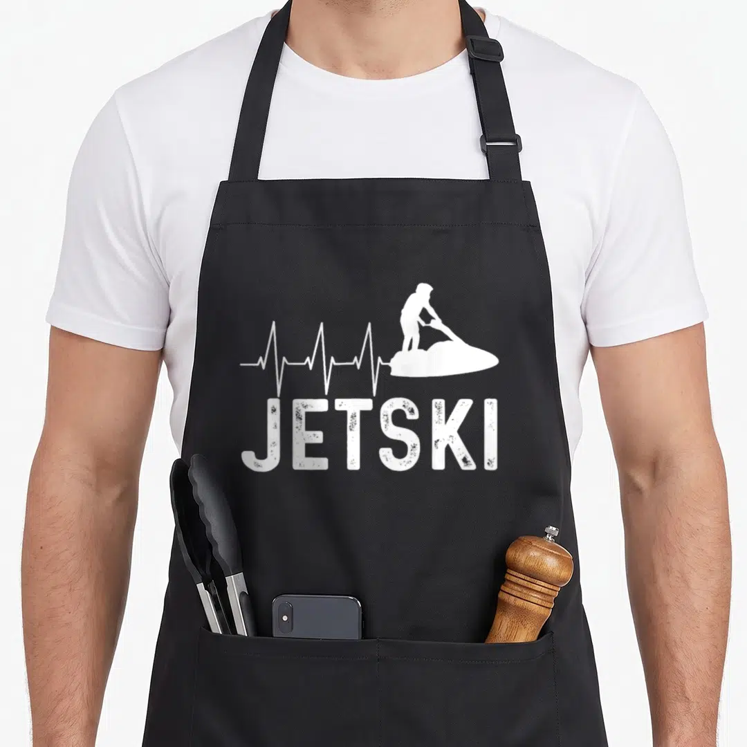 Sport jetski apron - White heartbeat line forming a jetski rider silhouette above JETSKI text — shown on a black cotton canvas apron against a white background