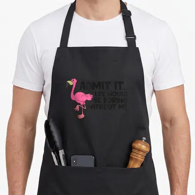 Admit flamingo apron - Pink cartoon flamingo standing next to black text admitting life would be boring without me — shown on a black cotton canvas apron against a white background