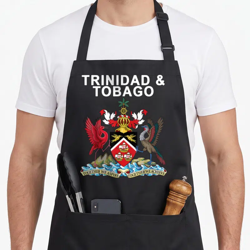 Trinidad trinidadian girl apron - Coat of arms with red bird, brown bird, shield, and text Together We Aspire Together — shown on a black cotton canvas apron against a white background