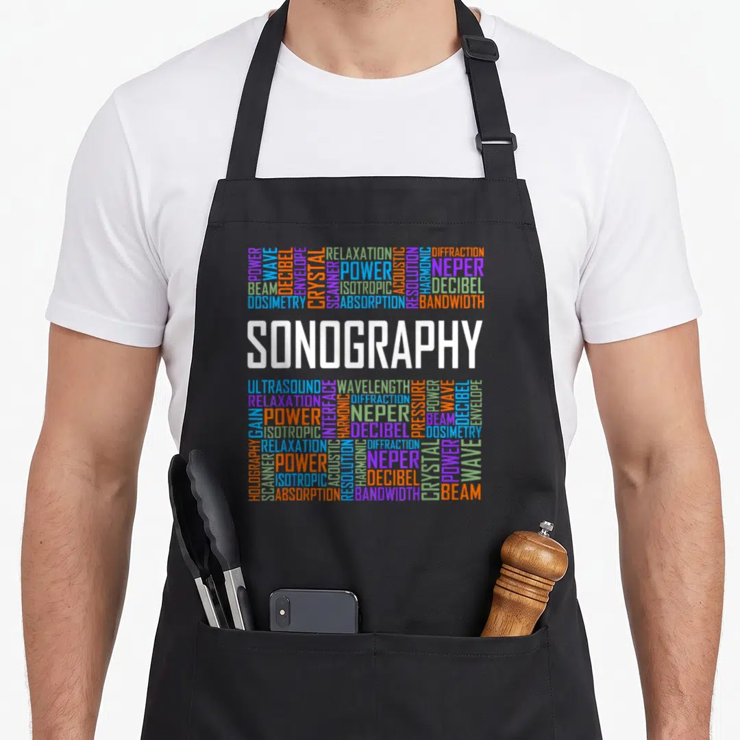Technologist sonographer apron - SONOGRAPHY text surrounded by acoustic terms in blue orange and purple — shown on a black cotton canvas apron against a white background