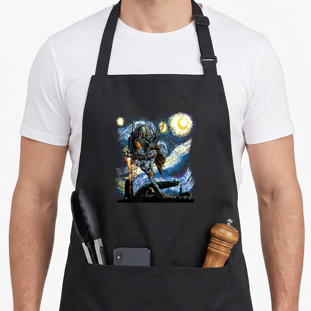 Starry night van gogh apron - The Mandalorian standing on black city silhouette against swirling blue yellow night sky — shown on a black cotton canvas apron against a white background
