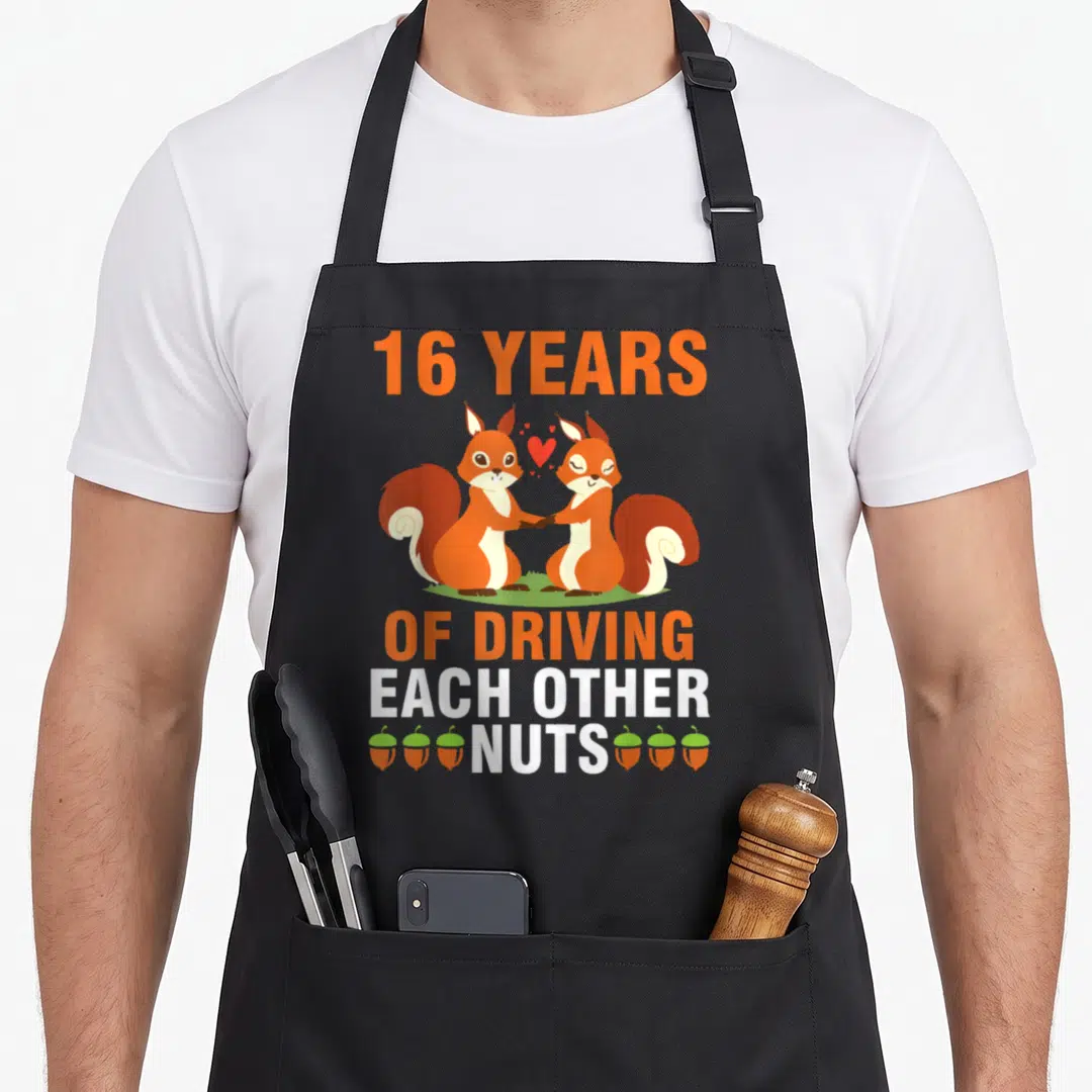 Wife married driving aprons - Two squirrels holding hands with 16 years driving each other nuts text and acorns — shown on a black cotton canvas apron against a white background