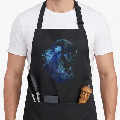 Island hair apron - Watercolor woman holding a spear with a ship integrated into blue swirling hair patterns — shown on a black cotton canvas apron against a white background