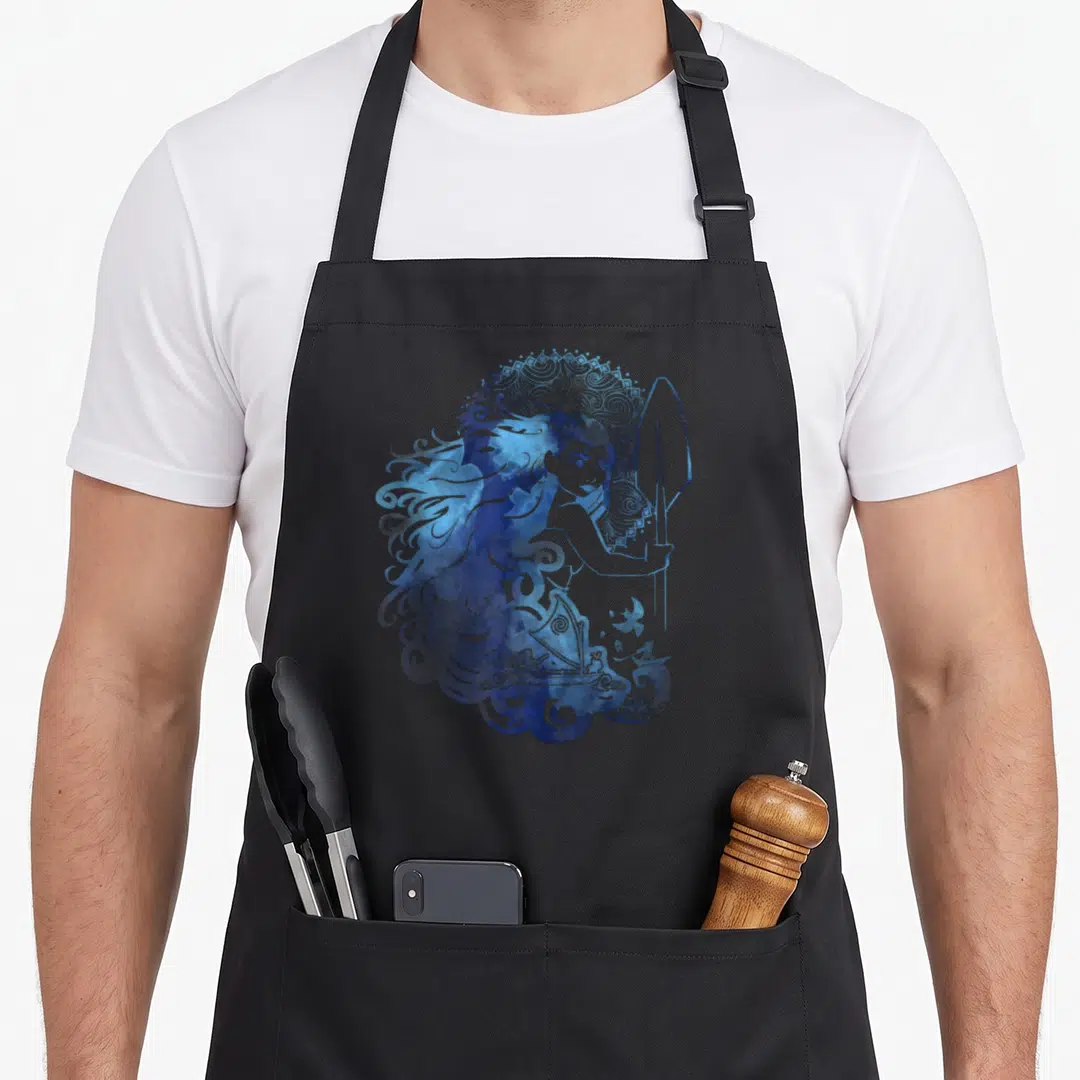 Island hair apron - Watercolor woman holding a spear with a ship integrated into blue swirling hair patterns — shown on a black cotton canvas apron against a white background