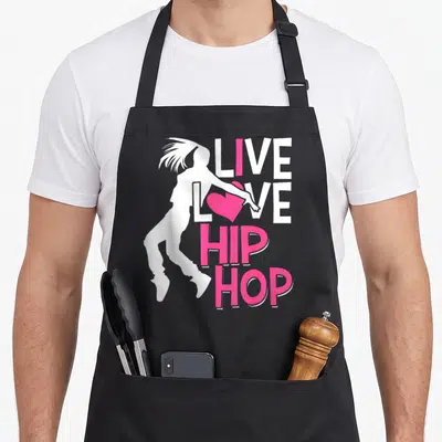 Dancer hip apron - White dancer silhouette overlapping stacked white and pink text with a pink heart in the word LOVE — shown on a black cotton canvas apron against a white background