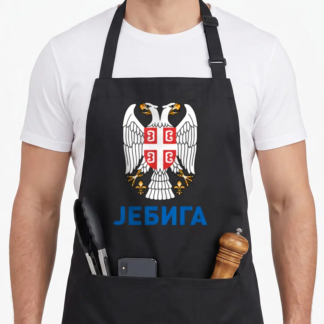Jebiga eagles apron - Realistic double-headed eagle with shield above blue Cyrillic text JEBUGA — shown on a black cotton canvas apron against a white background