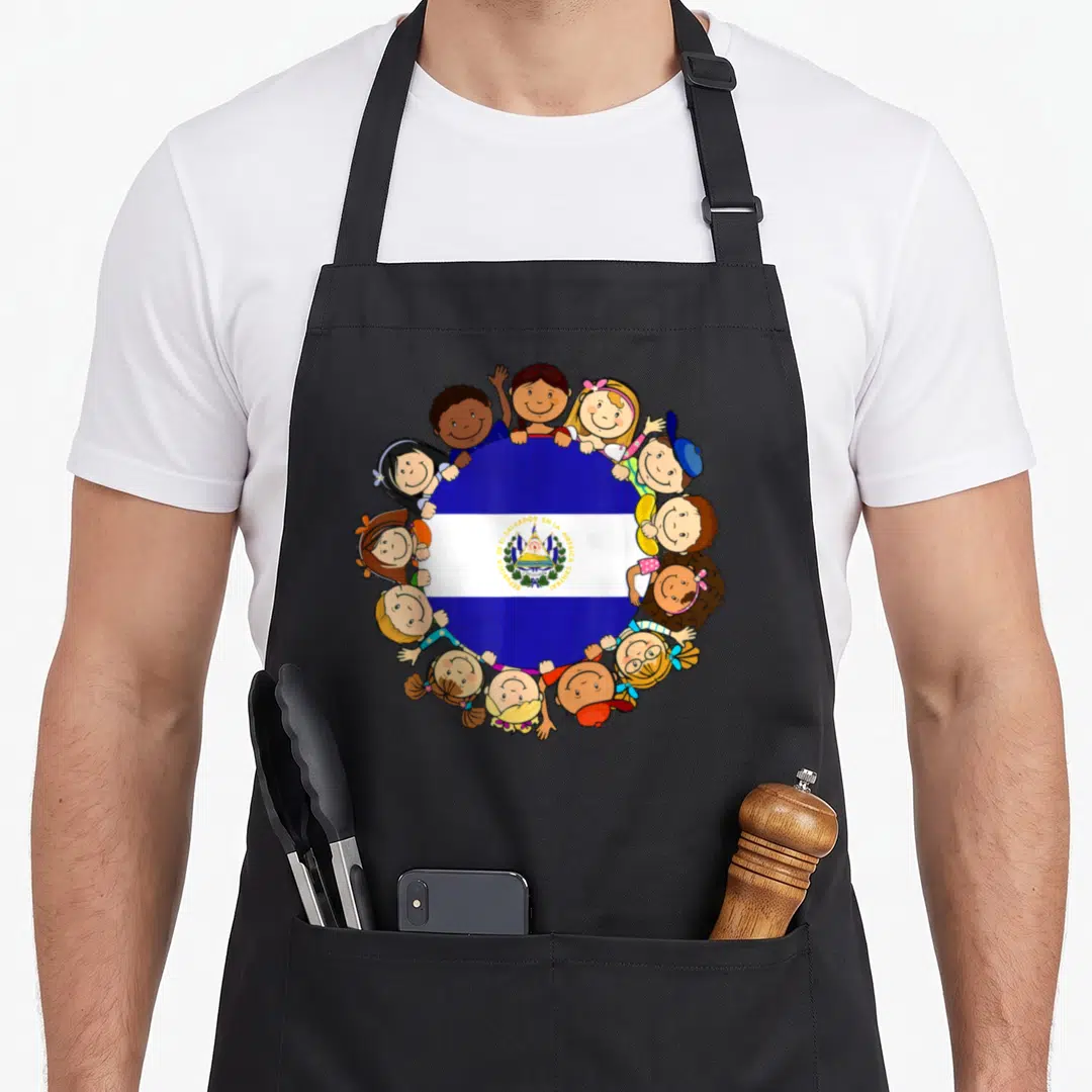 Hispanic salvadoran apron - Circular El Salvador flag surrounded by twelve cartoon children peeking over the edge — shown on a black cotton canvas apron against a white background