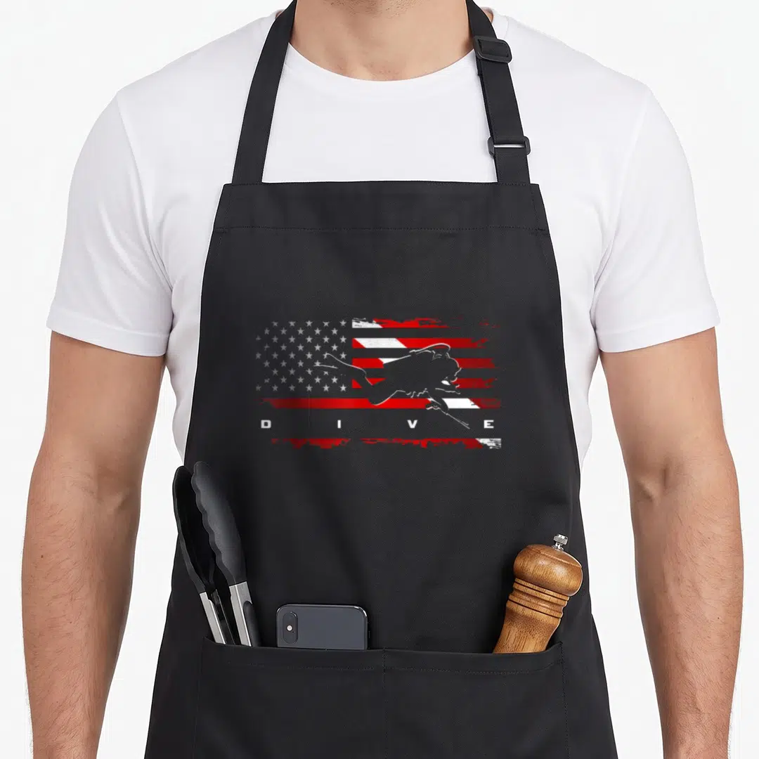 Scuba american flag apron - Distressed red white grey flag with grey diver silhouette and white DIVE text — shown on a black cotton canvas apron against a white background