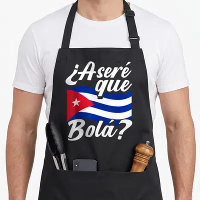 Asere cuban apron - Cuban flag in white blue red with ¿Aseré que Bolá? text above and below — shown on a black cotton canvas apron against a white background