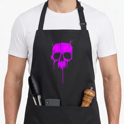 Hard paint apron - Purple distressed skull with dripping paint effects at the bottom — shown on a black cotton canvas apron against a white background