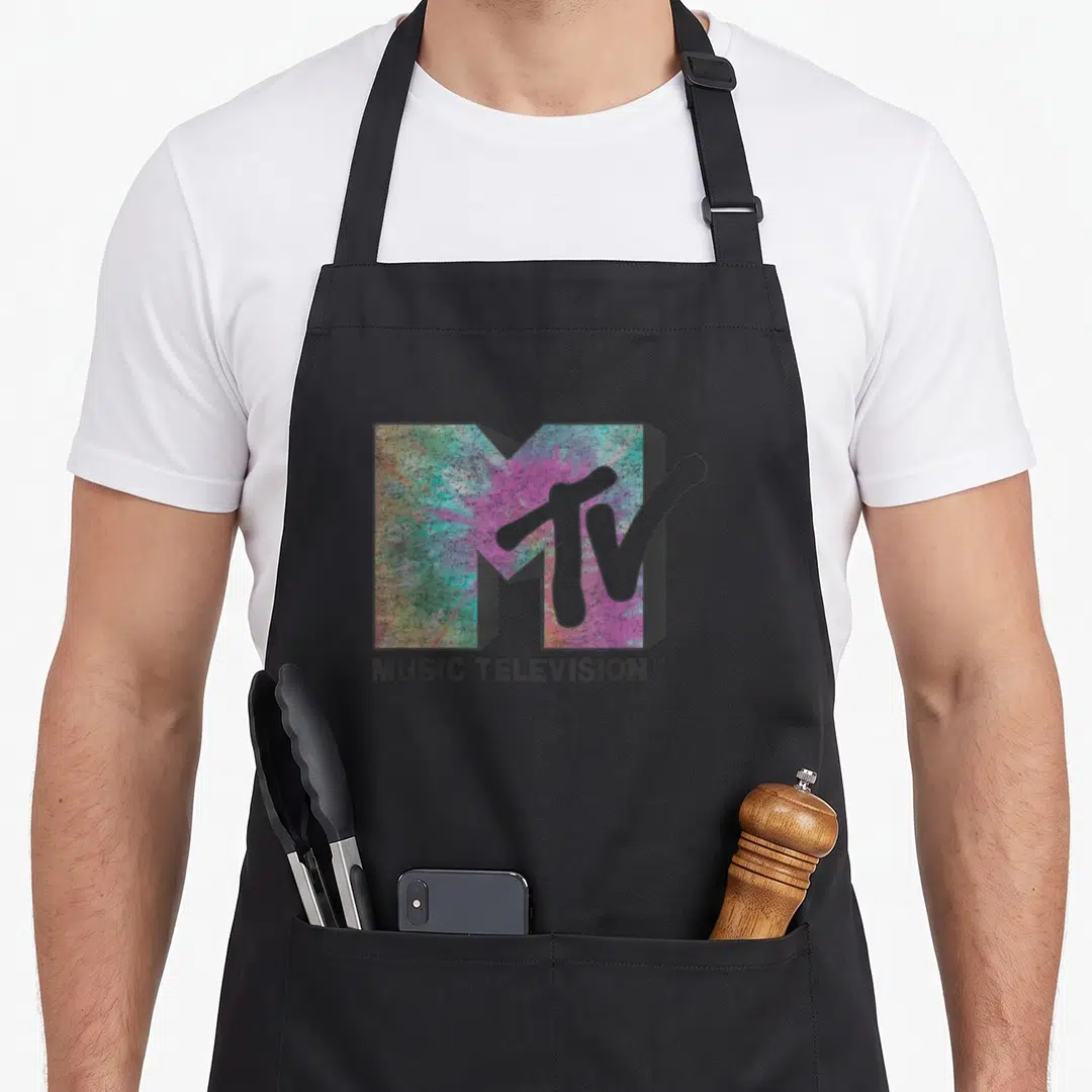 Mtv tie apron - Distressed MTV logo with tie-dye fill and MUSIC TELEVISION text below — shown on a black cotton canvas apron against a white background