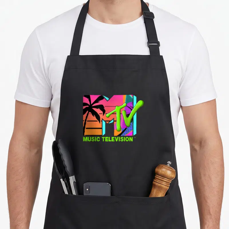 Mtv theme party apron - Retro MTV logo with palm trees inside M and MUSIC TELEVISION text in lime green — shown on a black cotton canvas apron against a white background