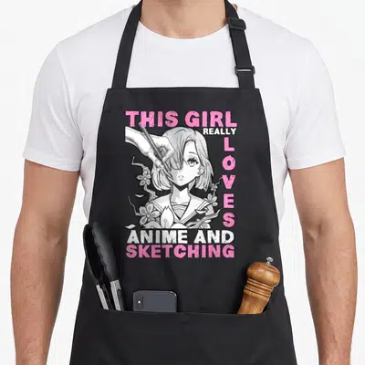 Sketching otaku anime apron - Cartoon girl sketching with pencil and pink text THIS GIRL REALLY LOVES ANIME — shown on a black cotton canvas apron against a white background