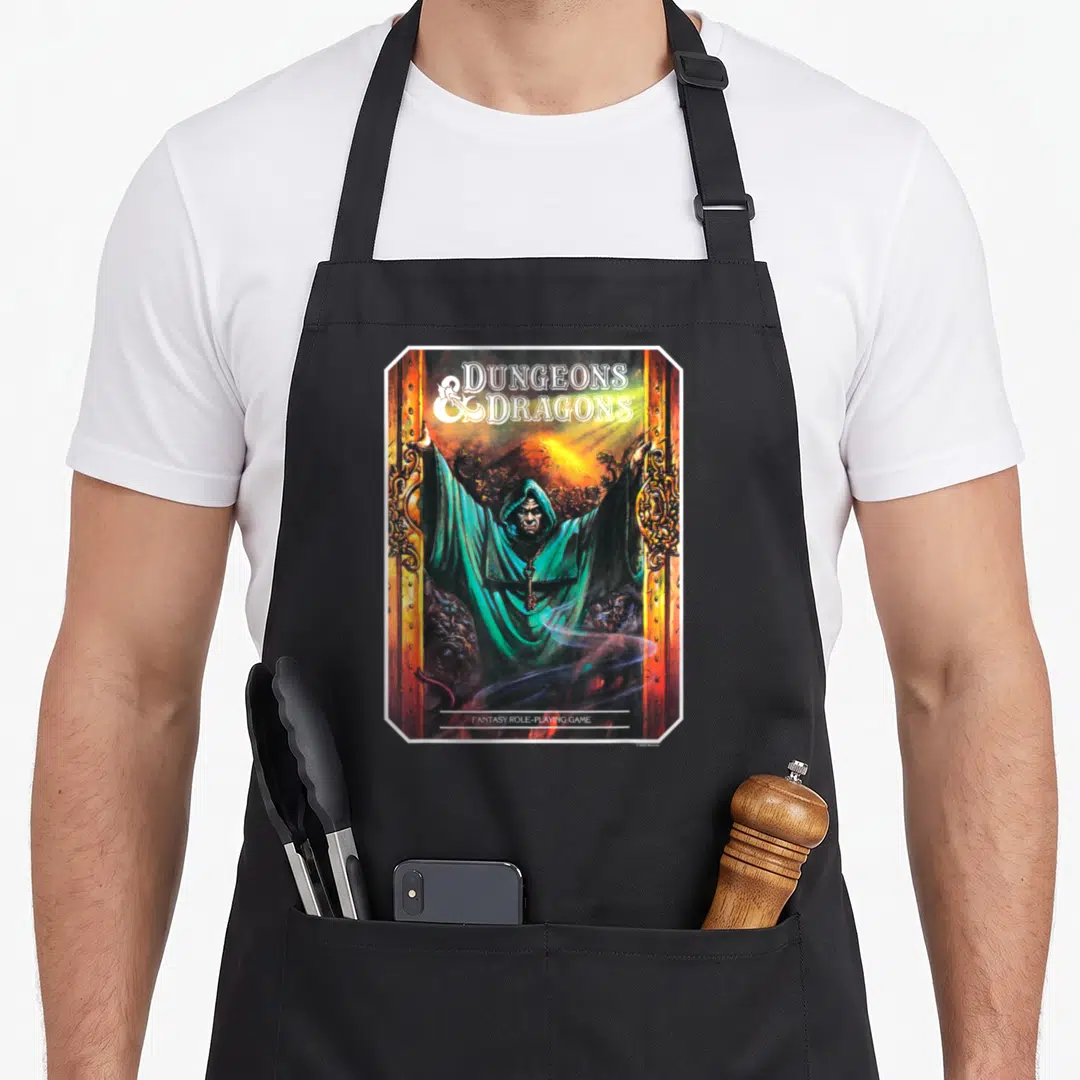 Dungeon guide master apron - Wizard in teal robe opening golden doors under DUNGEONS DRAGONS text — shown on a black cotton canvas apron against a white background