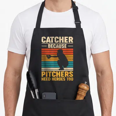 Heroe baseball apron - Grey catcher silhouette over beige yellow red orange and teal stripes with text — shown on a black cotton canvas apron against a white background
