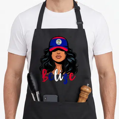 Belizean belize apron - Cartoon woman in red blue cap with Belize script text and coat of arms emblem — shown on a black cotton canvas apron against a white background