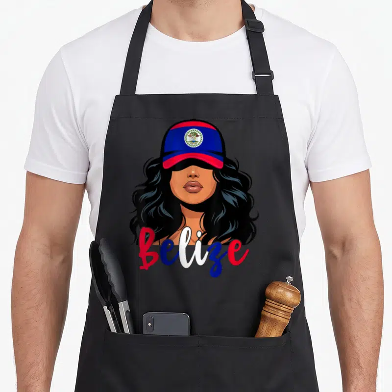 Belizean belize apron - Cartoon woman in red blue cap with Belize script text and coat of arms emblem — shown on a black cotton canvas apron against a white background