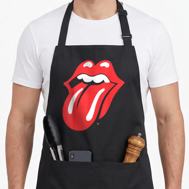 Racerback rolling stones apron - Red and white cartoon mouth with tongue sticking out and small trademark symbol — shown on a black cotton canvas apron against a white background