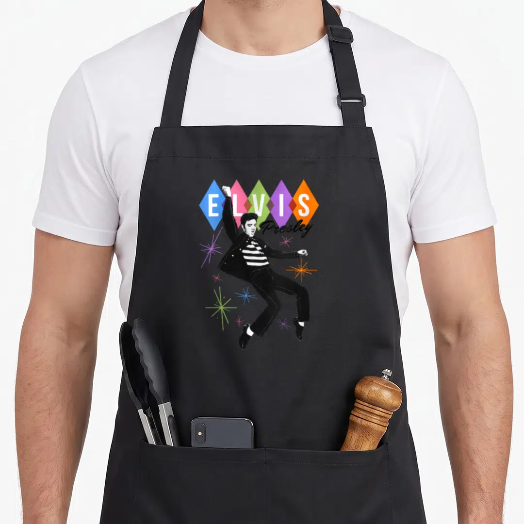 Elvis dancing apron - Retro Elvis Presley figure with five colored diamonds and scattered stars — shown on a black cotton canvas apron against a white background